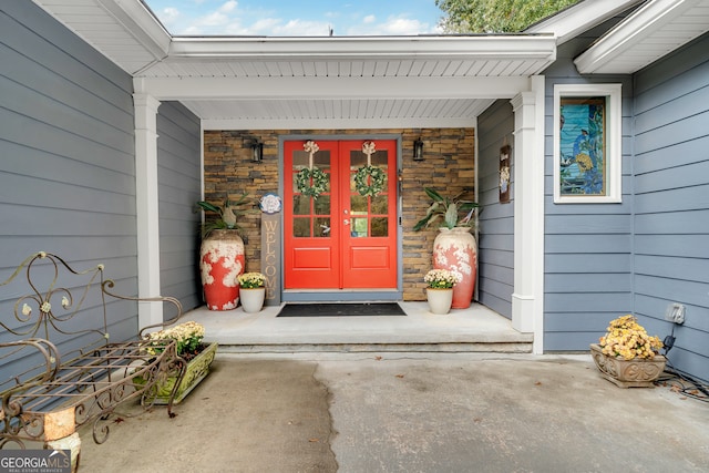 property entrance with french doors and a porch