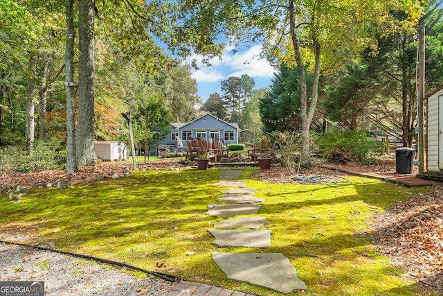 view of yard with a wooden deck