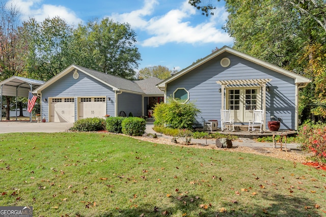 single story home with a garage, a front yard, and a carport