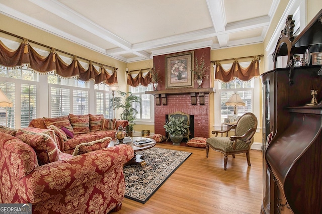 interior space featuring a brick fireplace, coffered ceiling, and beam ceiling