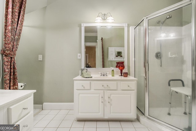 full bathroom featuring tile patterned flooring, vanity, and a shower stall