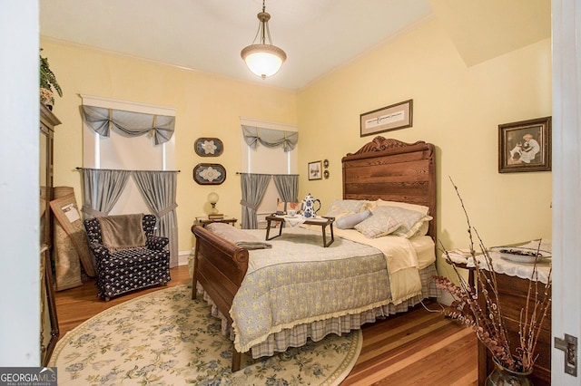 bedroom featuring wood finished floors