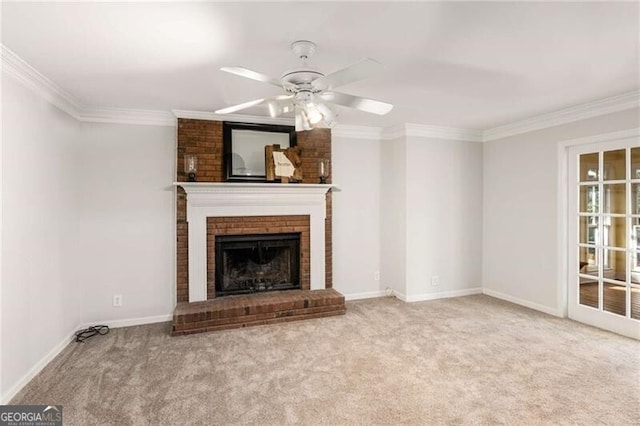 unfurnished living room with ceiling fan, light colored carpet, ornamental molding, and a brick fireplace