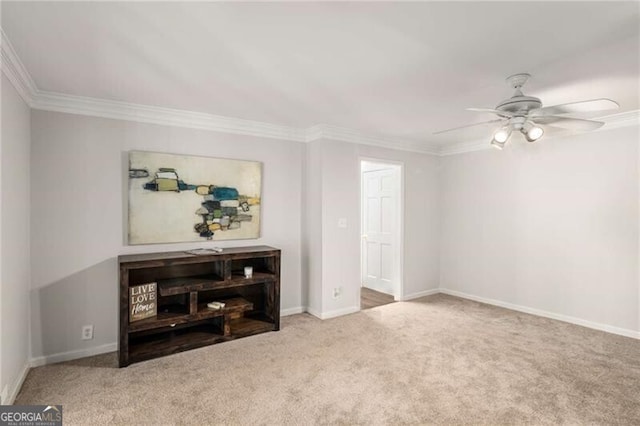 interior space featuring ceiling fan and crown molding