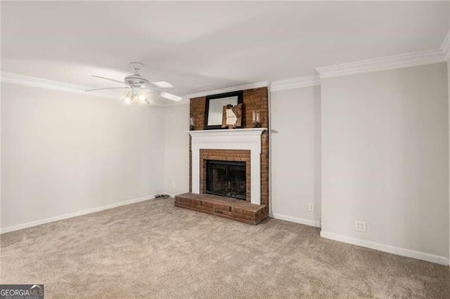 unfurnished living room with ornamental molding, a fireplace, light carpet, and ceiling fan