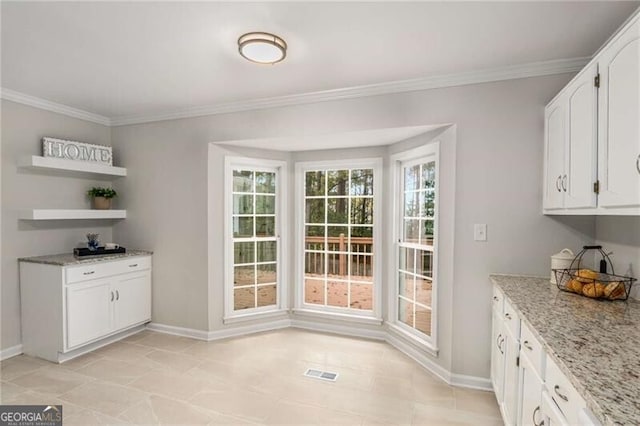 dining area with crown molding