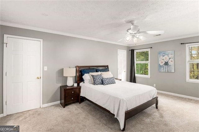 bedroom featuring ornamental molding, light carpet, and ceiling fan