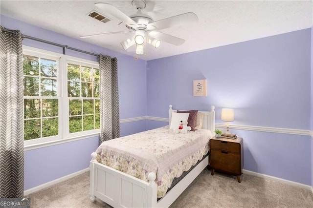 carpeted bedroom with ceiling fan