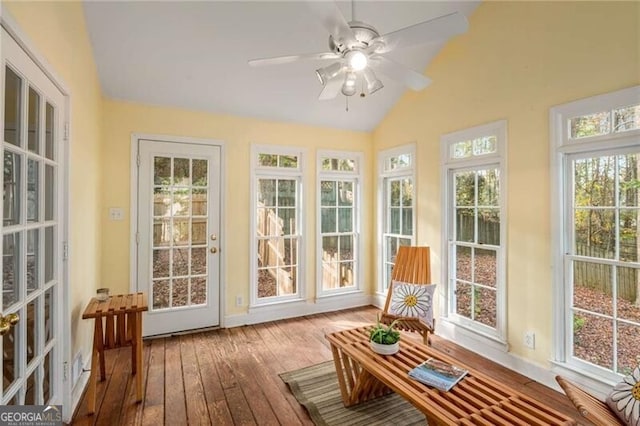 sunroom / solarium featuring plenty of natural light and lofted ceiling