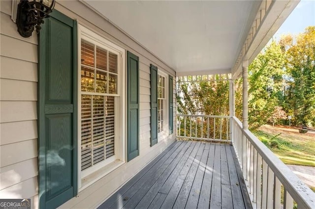 wooden terrace featuring a porch