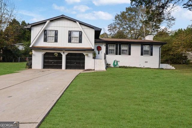 tri-level home featuring a garage and a front yard