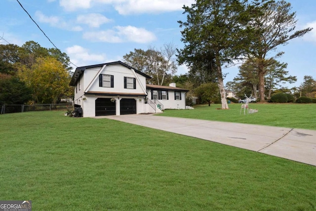 view of front of home with a garage and a front lawn