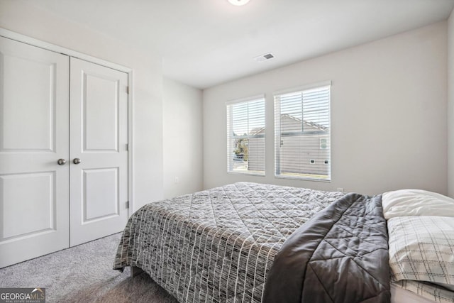 carpeted bedroom with a closet