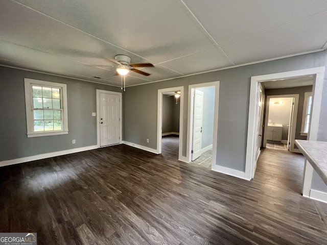 interior space featuring ceiling fan and dark hardwood / wood-style flooring