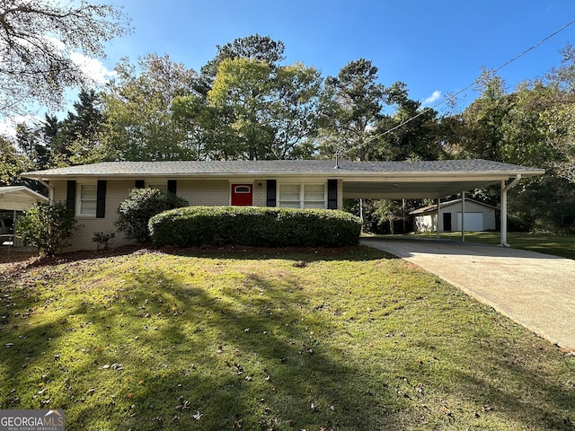 ranch-style home with a front lawn, an outdoor structure, and a carport