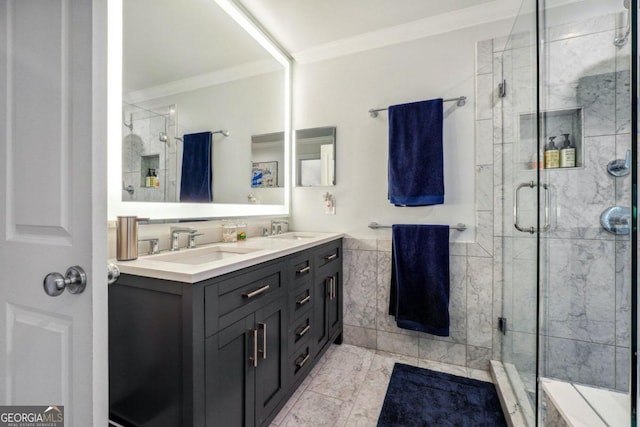 bathroom featuring vanity, an enclosed shower, and ornamental molding