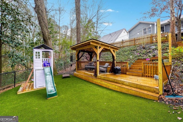 deck with a lawn and a gazebo