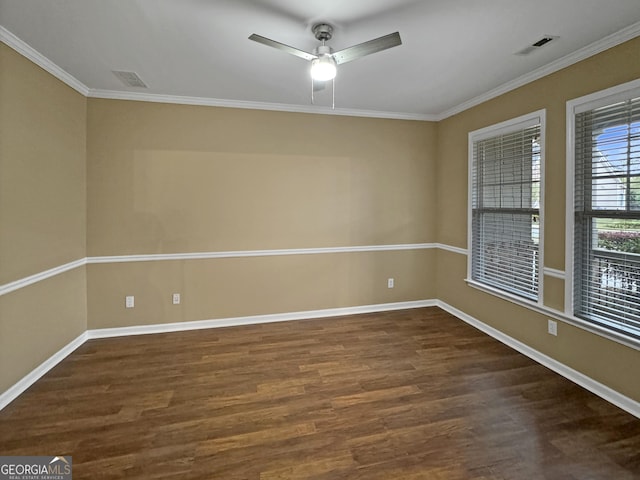 empty room with dark hardwood / wood-style floors, ceiling fan, and crown molding