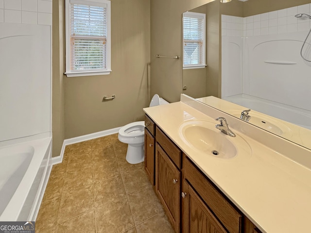 bathroom with tile patterned flooring, vanity, and toilet