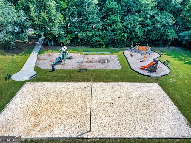 view of community with a lawn and a playground