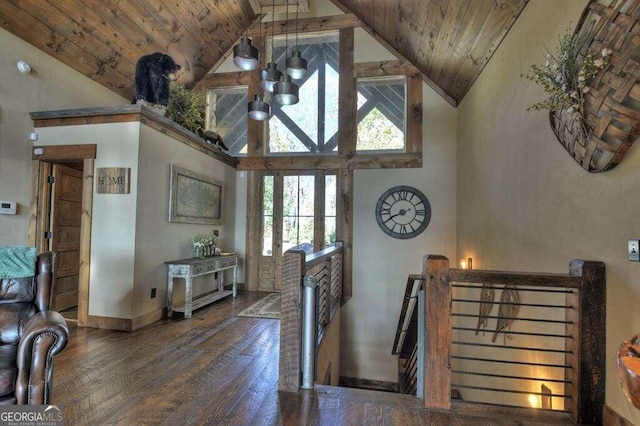 interior space featuring wooden ceiling, hardwood / wood-style flooring, an inviting chandelier, and high vaulted ceiling