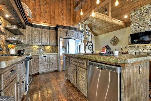 kitchen with dark hardwood / wood-style flooring, wood ceiling, an island with sink, lofted ceiling with beams, and appliances with stainless steel finishes