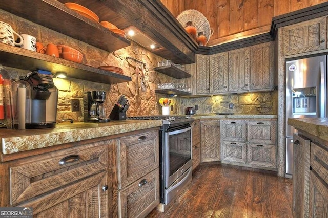 kitchen featuring dark wood-type flooring and stainless steel appliances