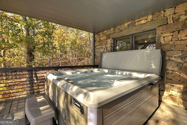 view of patio / terrace with a hot tub