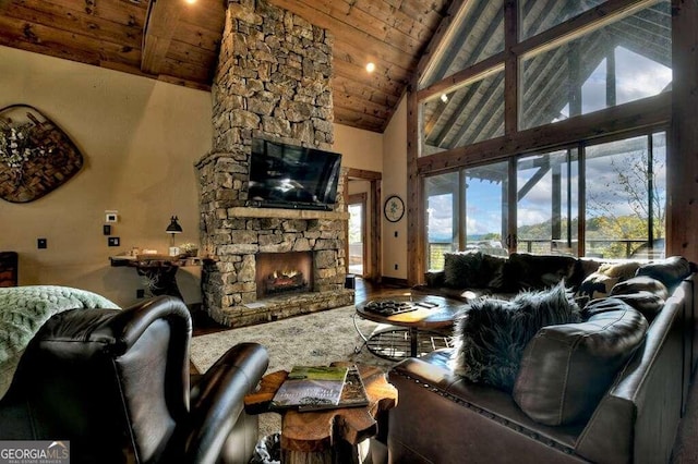 living room with a fireplace, wood ceiling, and high vaulted ceiling