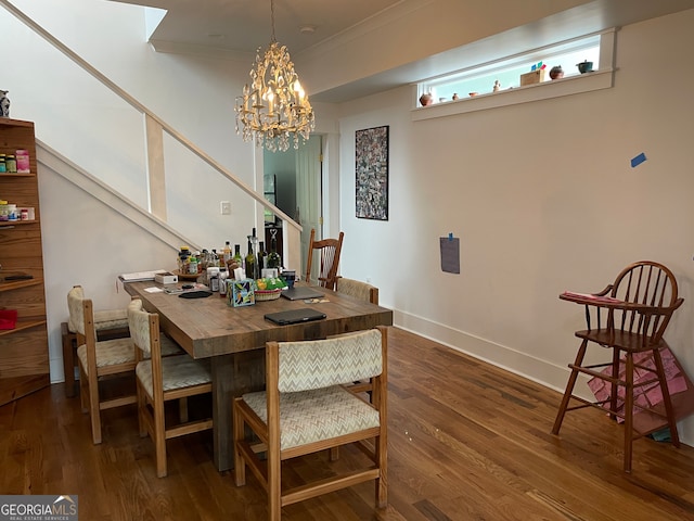 dining room with a chandelier, dark hardwood / wood-style floors, and crown molding