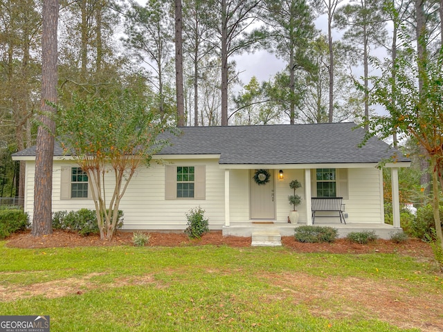 single story home featuring a front yard and covered porch