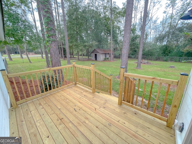 wooden terrace with a yard and a shed