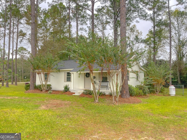 view of front of home featuring a front yard and covered porch