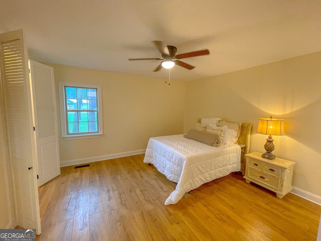 bedroom featuring ceiling fan and light hardwood / wood-style flooring