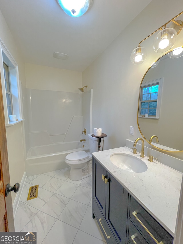 full bathroom featuring washtub / shower combination, toilet, and vanity