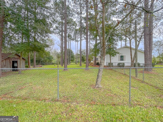 view of yard with a storage unit