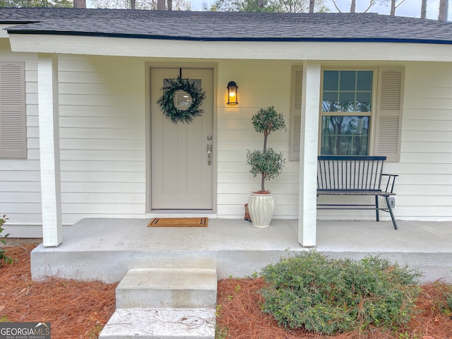 property entrance featuring covered porch