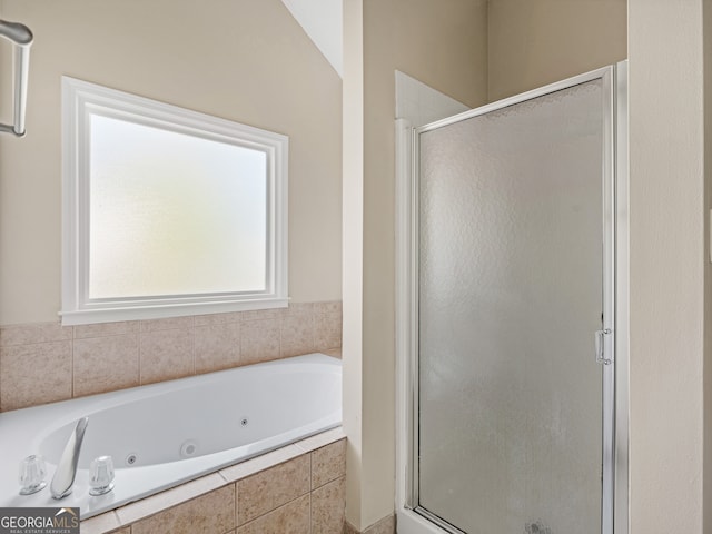 bathroom featuring plus walk in shower