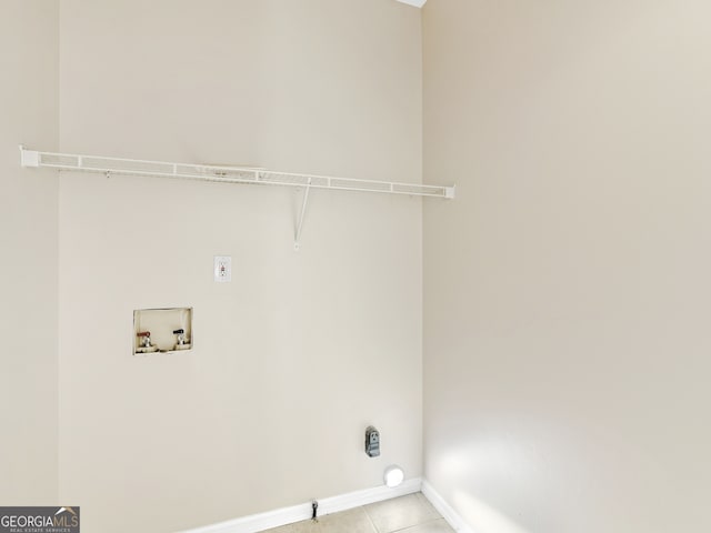 washroom featuring washer hookup and light tile patterned flooring