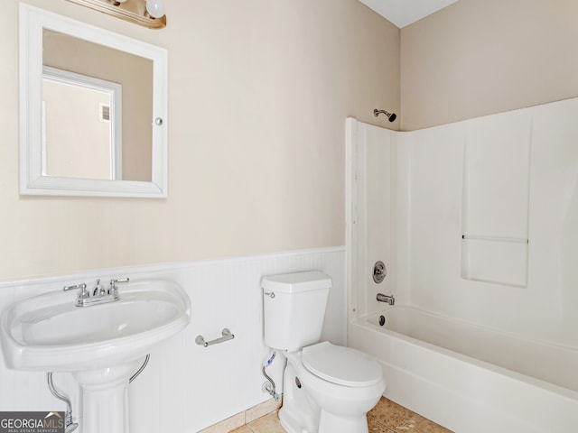 full bathroom with tile patterned floors, toilet, sink, and bathtub / shower combination