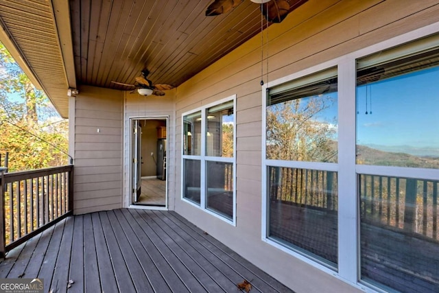 wooden deck with ceiling fan