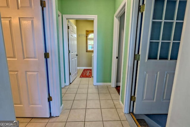 hallway with light tile patterned floors