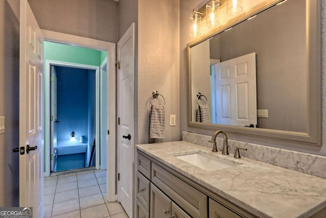 bathroom featuring vanity and tile patterned flooring