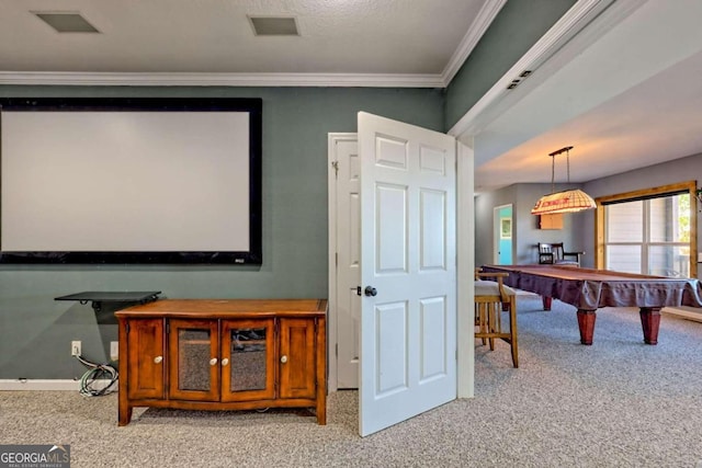 home theater featuring light colored carpet, pool table, and ornamental molding