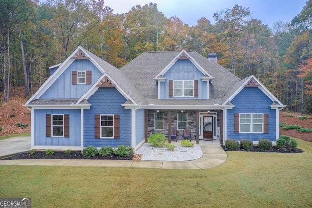 craftsman-style house with a front yard