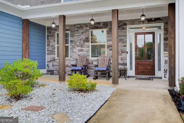 property entrance with covered porch