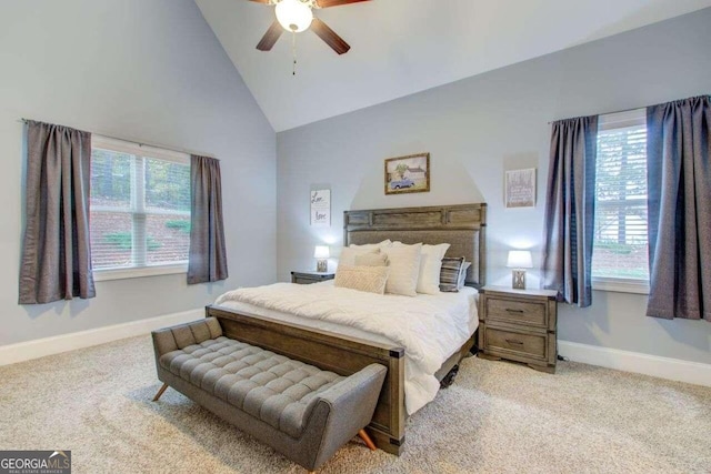 bedroom featuring high vaulted ceiling, light colored carpet, and ceiling fan