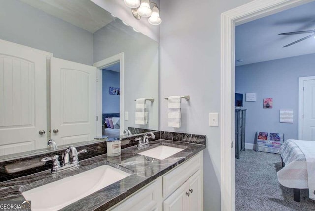 bathroom with ceiling fan and vanity