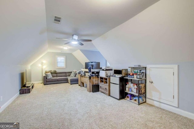 bonus room featuring ceiling fan, light carpet, and lofted ceiling