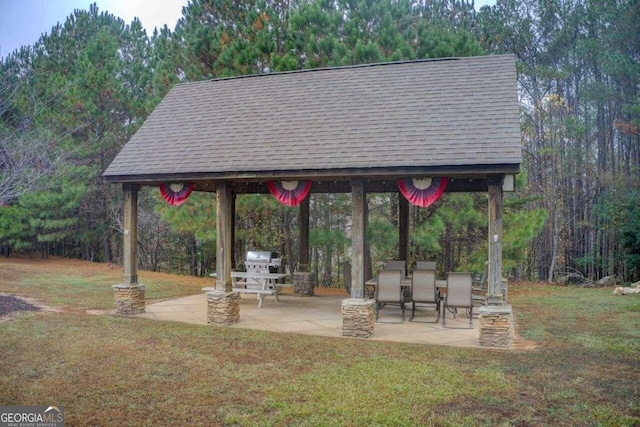 exterior space with a patio, a yard, and a gazebo